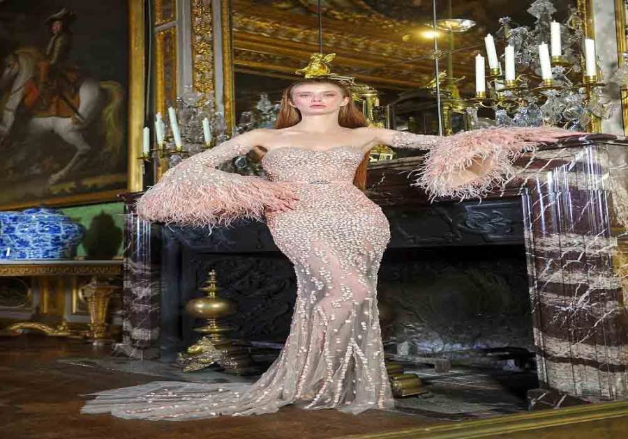 صور.. "نكد" يُشعل بيت الأزياء الراقية بـ"طيور الحب" في باريس