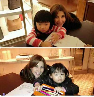  نانسي عجرم بدون ماكياج مع طفلتين من شرق آسيا