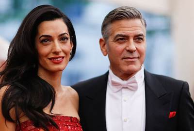 جورج وأمل كلوني ينقذان لاجئ عراقي‎